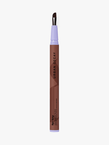 Urban Decay Lip Toy Brush Staining Lip Liner in branded component on a light gray background