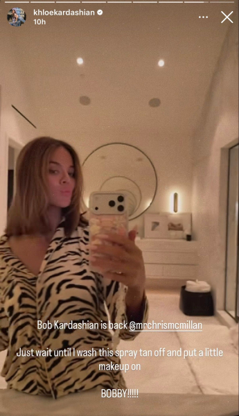 Khlo Kardashian poses in her bathroom wearing zebra pajamas. Her hair is cut in a long blunt bob.