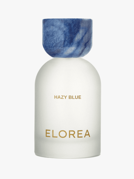 Elorea Hazy Blue Extrait de Parfum in branded component on a light gray background